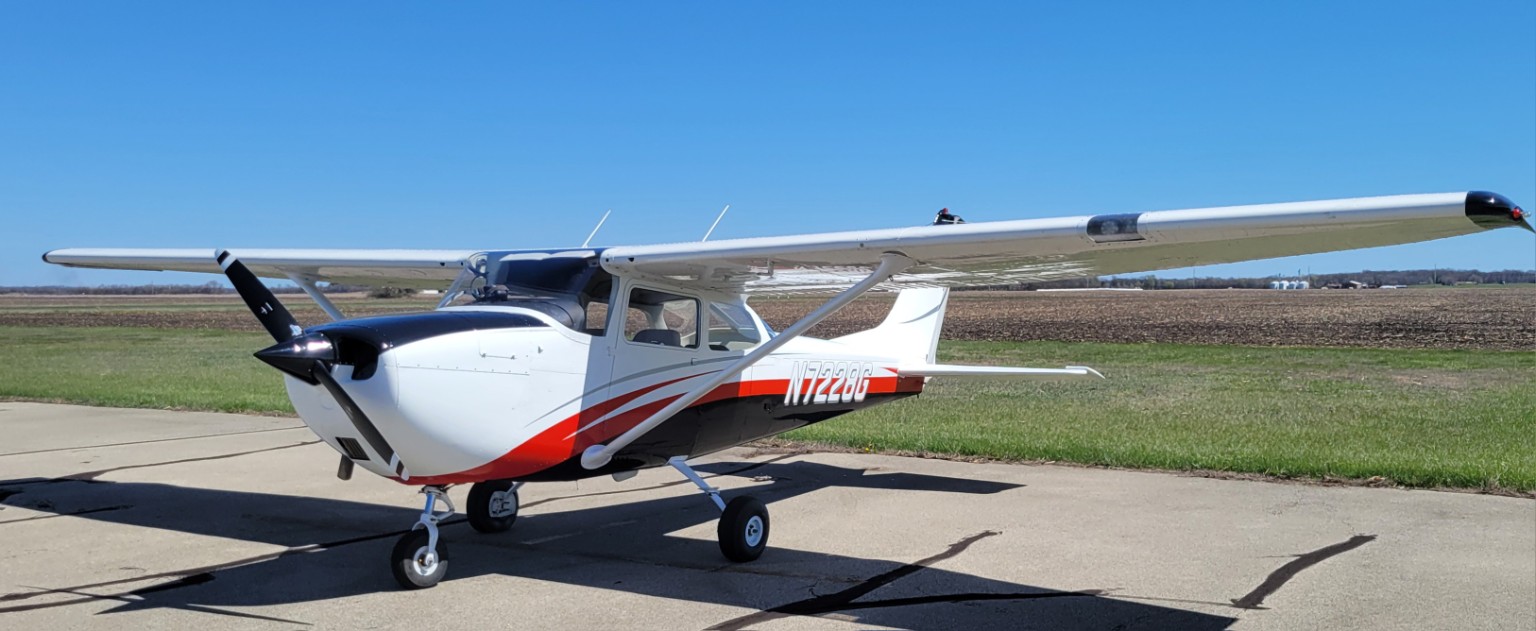 Throttle Up Flight Academy Cessna 172K parked on the ramp
